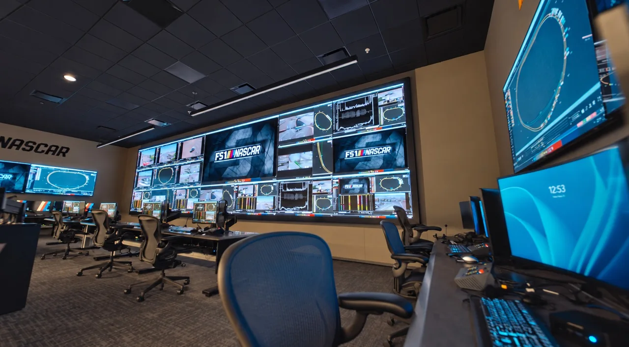An operations control room with a large LED display wall