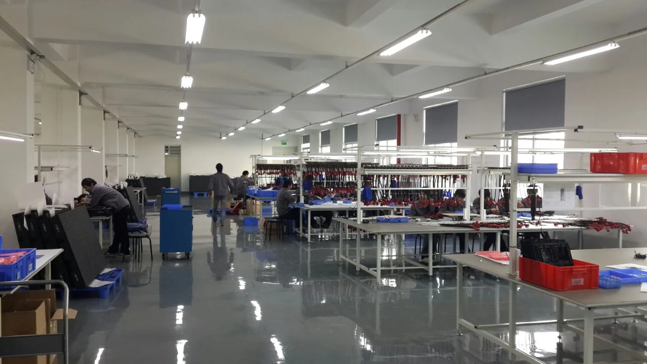 Abcoya production floor with assembly benches and display components