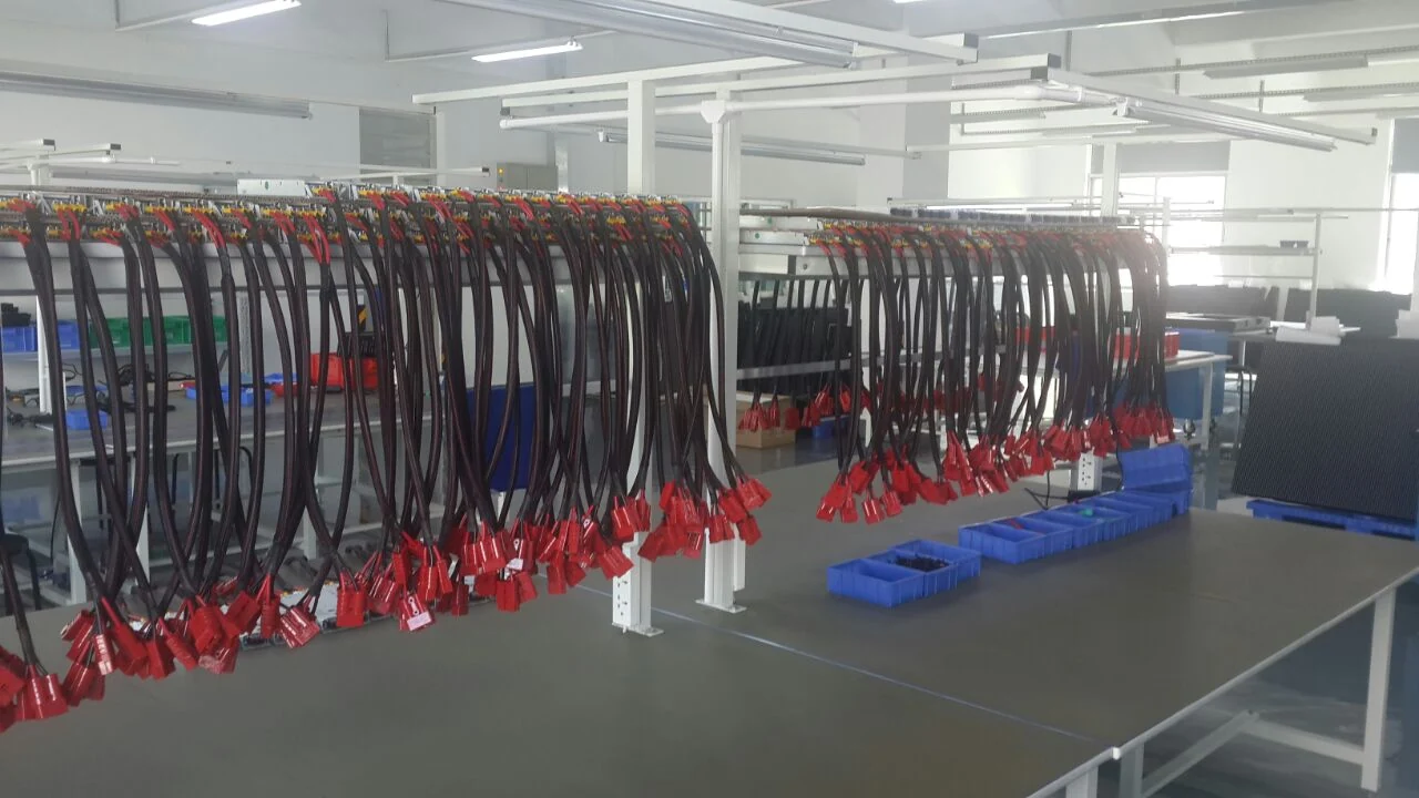 Prepared cable harnesses on racks inside the Abcoya factory